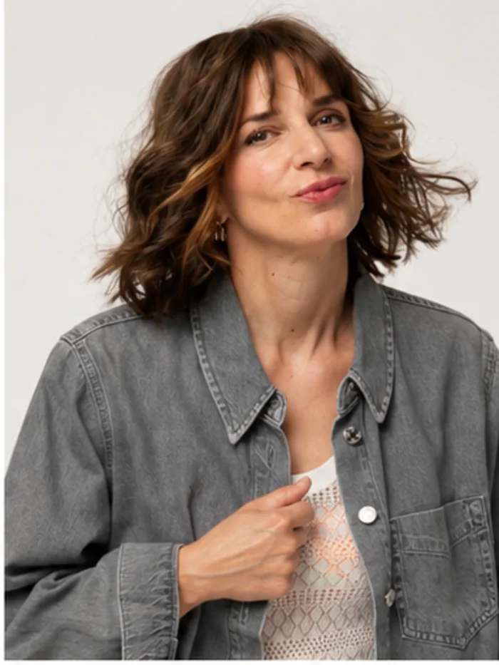 HEADS client wearing a hair topper with a curly bob, photographed in the studio