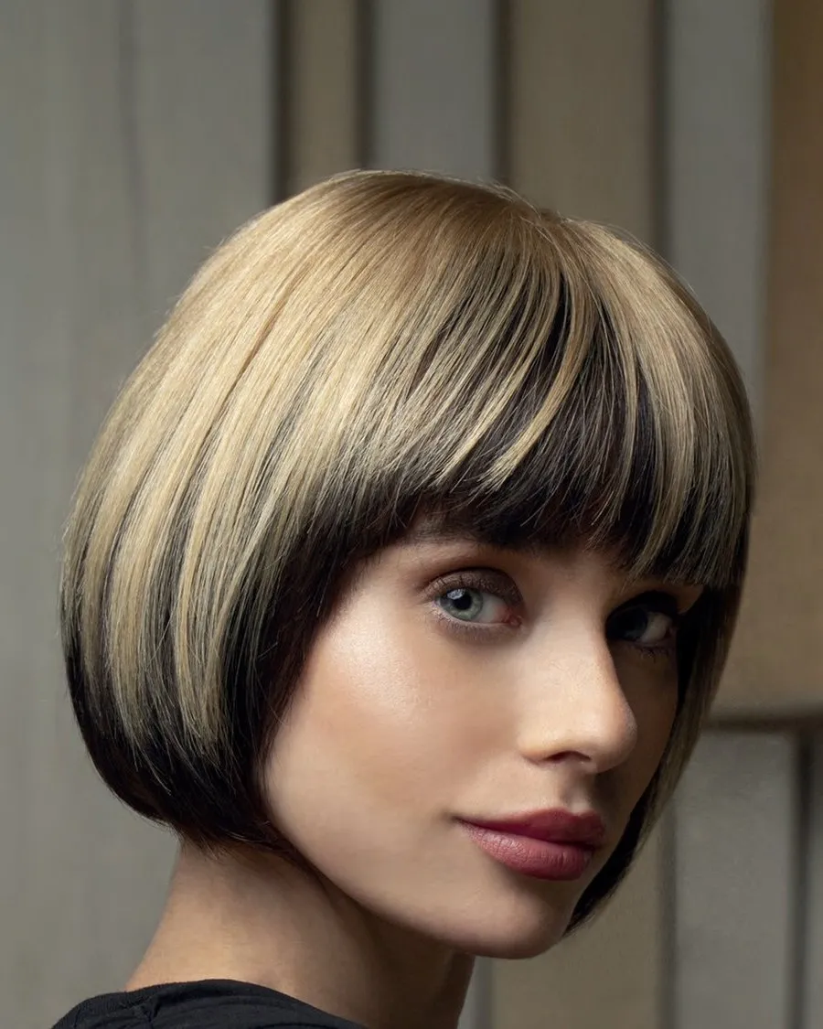 Model with a sleek two-tone bob topper