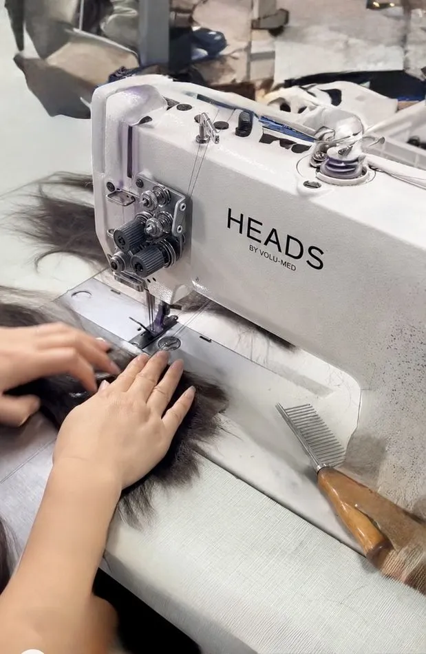 Sewing a topper on a HEADS by volu-med machine