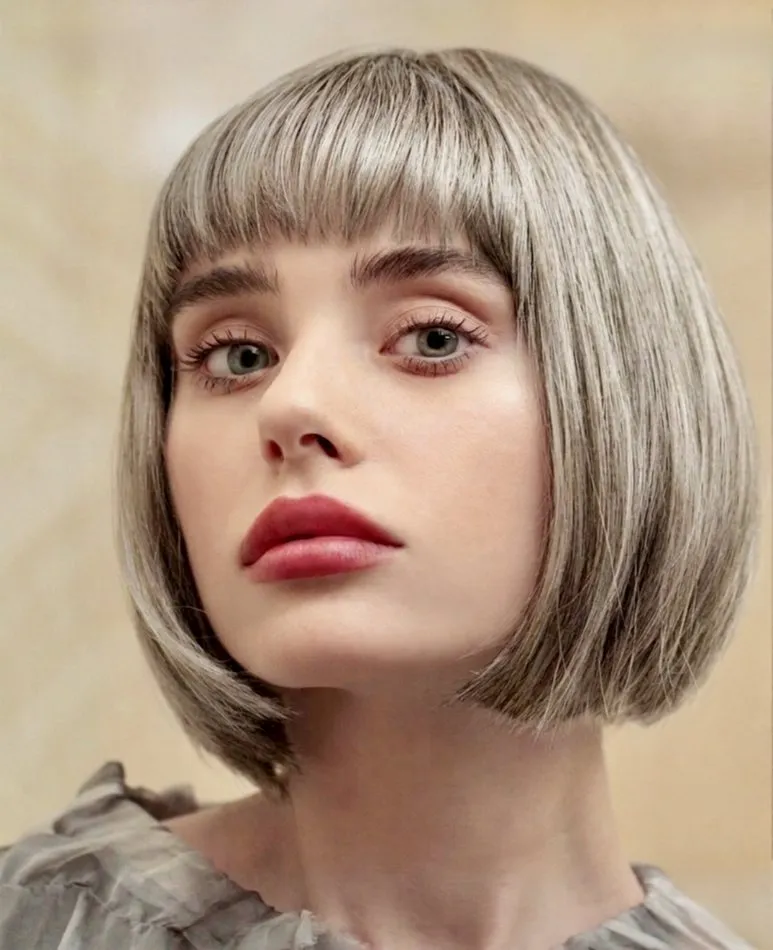 Silver blonde bob styled with a hair topper